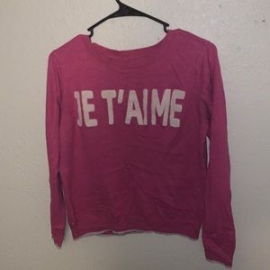 I am selling a pink sweater.